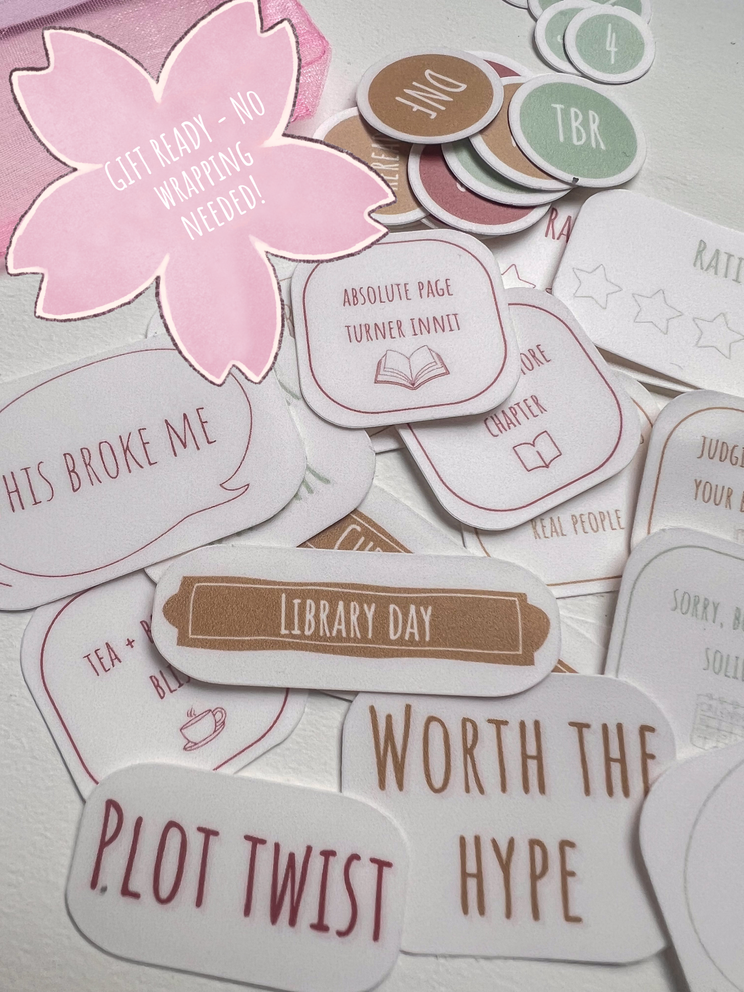 Collection of book-themed stickers on a light background